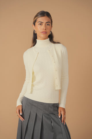 cinnamon sleeveless cable turtleneck